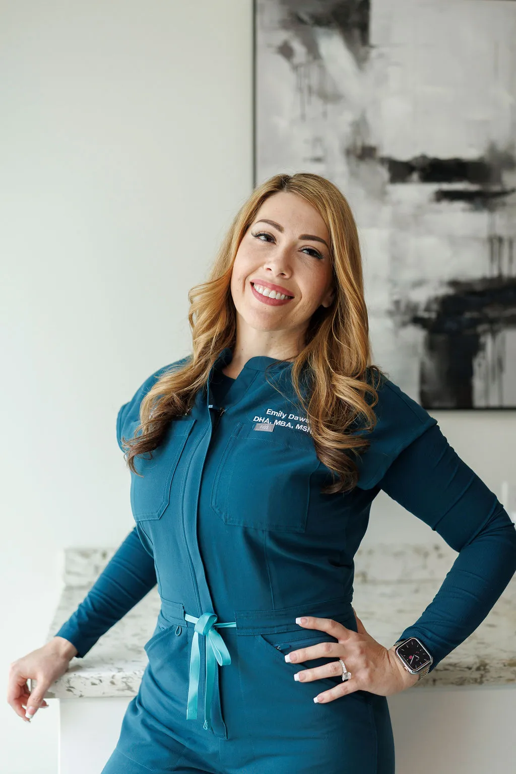 Emily Dawson in teal Avinity scrubs at the clinic