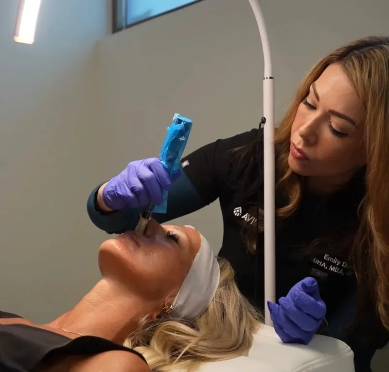 Registered nurse performing medical-grade microneedling at Avinity Health, minutes from Gainey Ranch in Scottsdale
