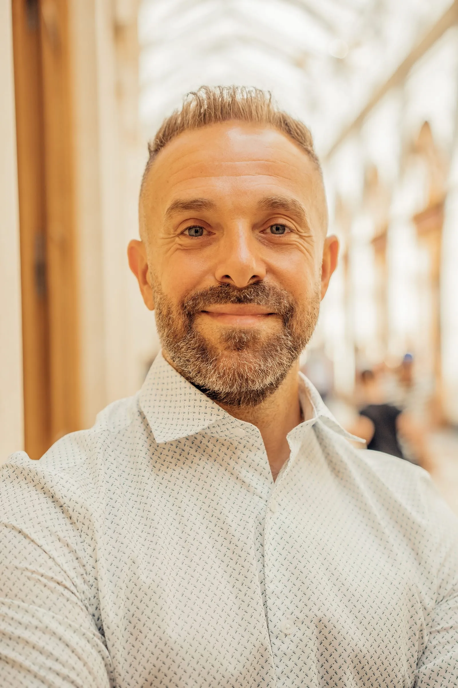 Smiling middle-aged man with a short graying beard