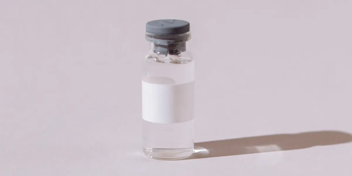 Clear injectable medication vial of the kind used for testosterone and hCG therapy